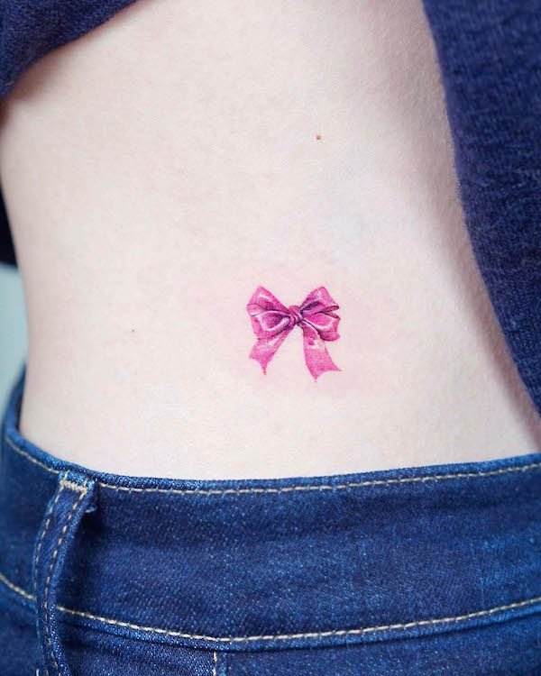 Small ribbon waist tattoo