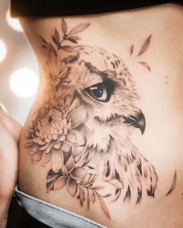 Stunning realism owl and flowers tattoo