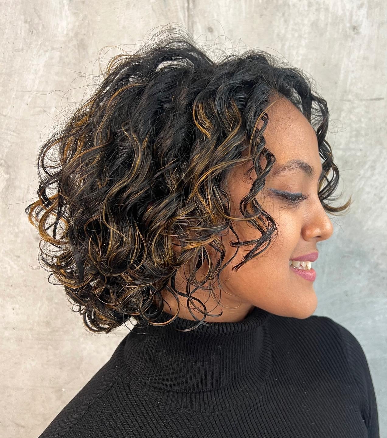 Curly Bob with Face-Framing Tendrils